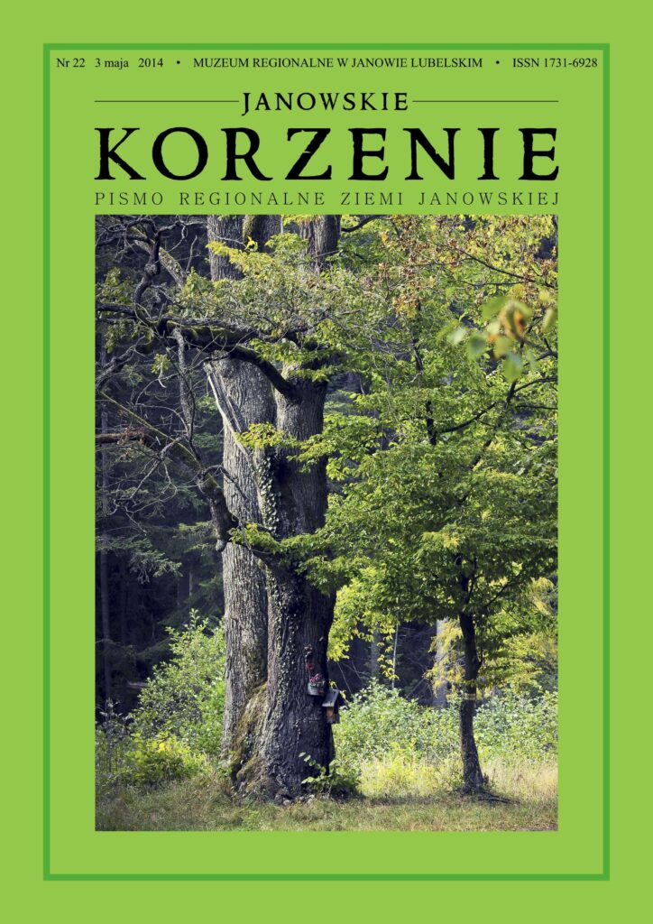 Dwa drzewa na tle leśnej polany, jedno z grubym pniem pokrytym bluszczem, zielone liście, trawa i krzewy.